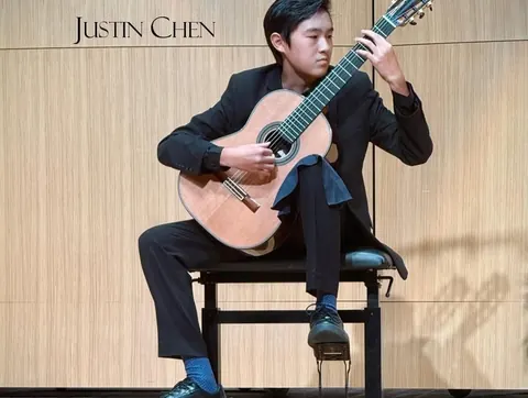 Justin Chen performing at a classical guitar competition
