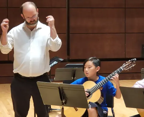 Justin Chen in an ensemble rehearsal