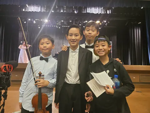 Justin Chen backstage with fellow musicians at the Fried Music Pre-College Final Concert