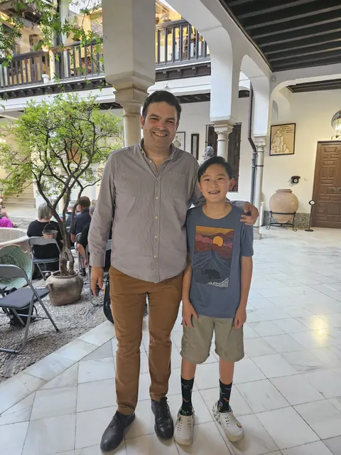 Justin Chen with a musician in Granada, Spain