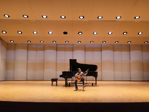 Justin Chen performing on stage