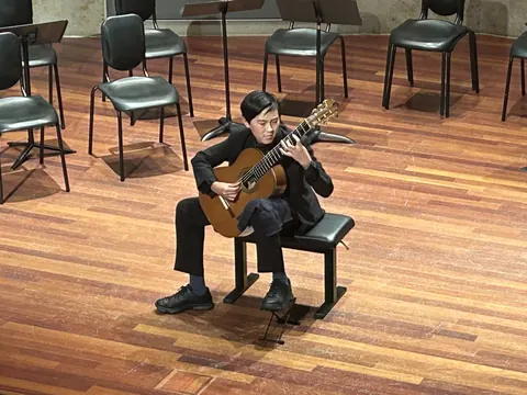 Justin Chen performing on stage
