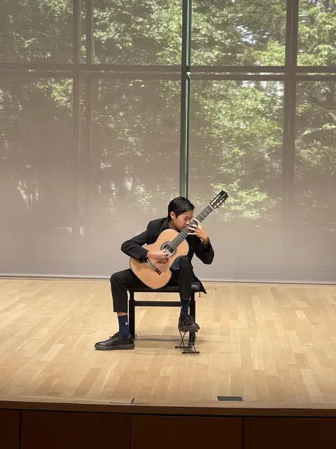 Justin Chen performing on stage