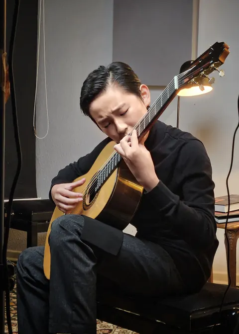Justin Chen playing classical guitar