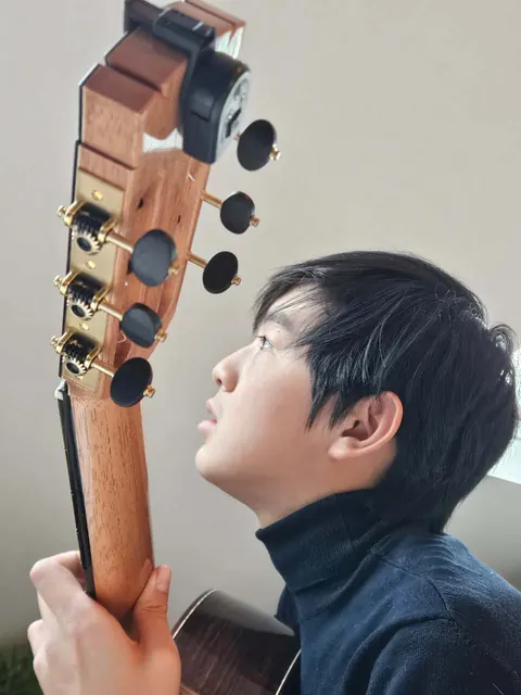 Justin Chen with his classical guitar