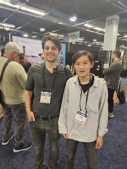 Justin Chen with a musician at The NAMM Show