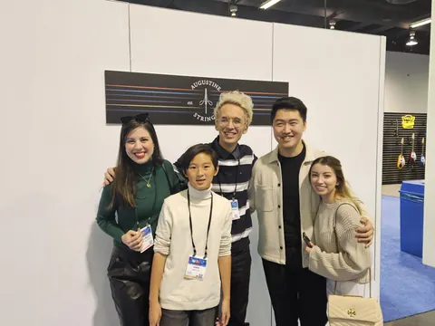 Justin Chen at the Augustine Strings booth at The NAMM Show