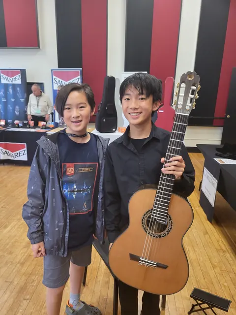 Justin Chen with a fellow guitarist