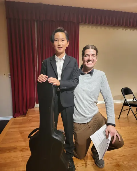 Justin Chen with a musician
