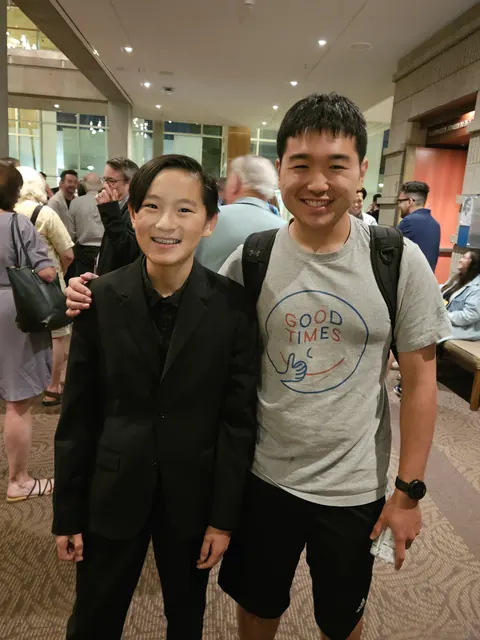 Justin Chen with a musician