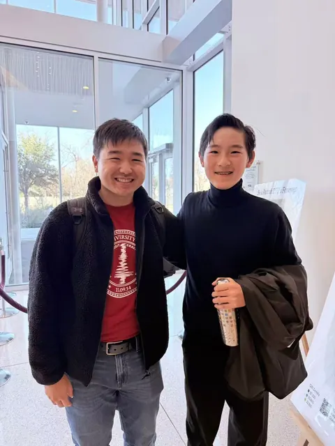 Justin Chen with a musician
